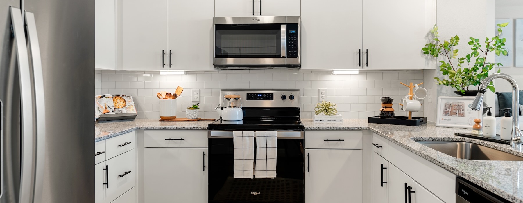 a kitchen with white cabinets