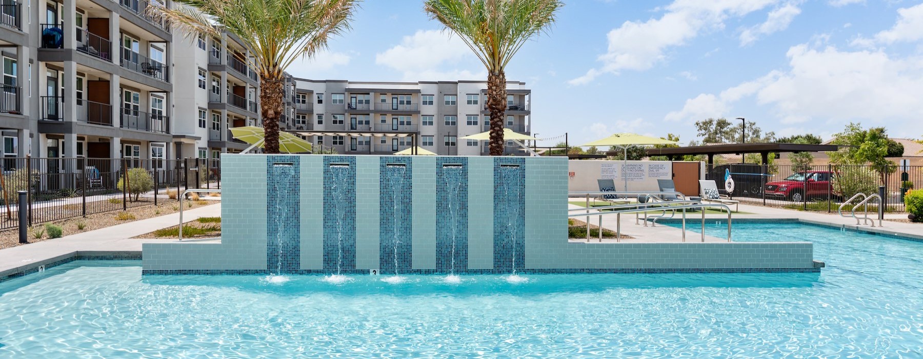 a pool with a building in the background