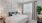 a bedroom with a bed and a fan