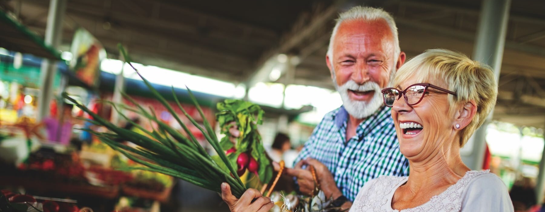a man and woman holding flowers