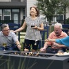 a group of people roasting marshmallows