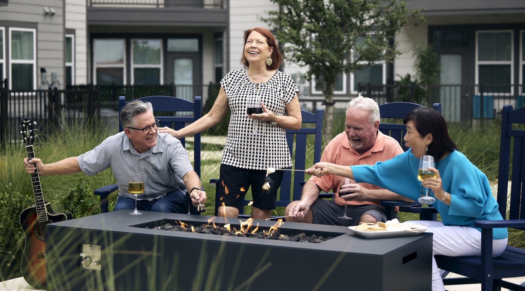 a group of people roasting marshmallows