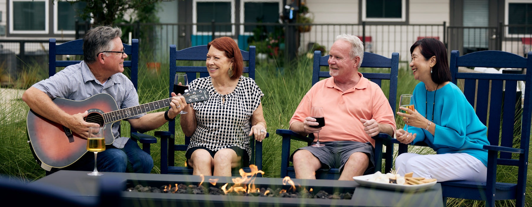 people sitting around a camp fire